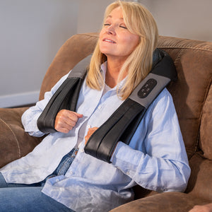Old_Woman_Use_Shiatsu_Neck_and_Back_Massager_On_Sofa