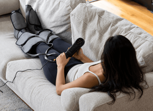 Woman_Uses_Leg_Calf_Massager_On_The_Sofa