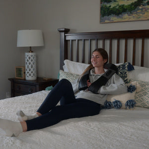 Young_Girl_Use_Shiatsu_Neck_Massager_On_Bed